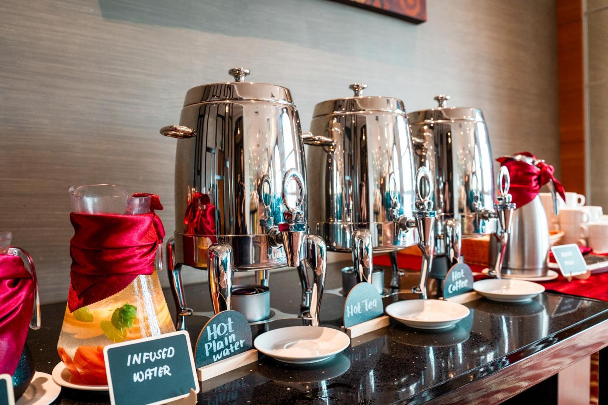 The Waterfront Hotel Kuching Exteriör bild A selection of hot and cold beverages